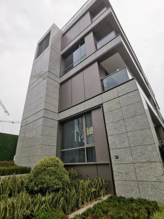Modern apartment building with granite cladding